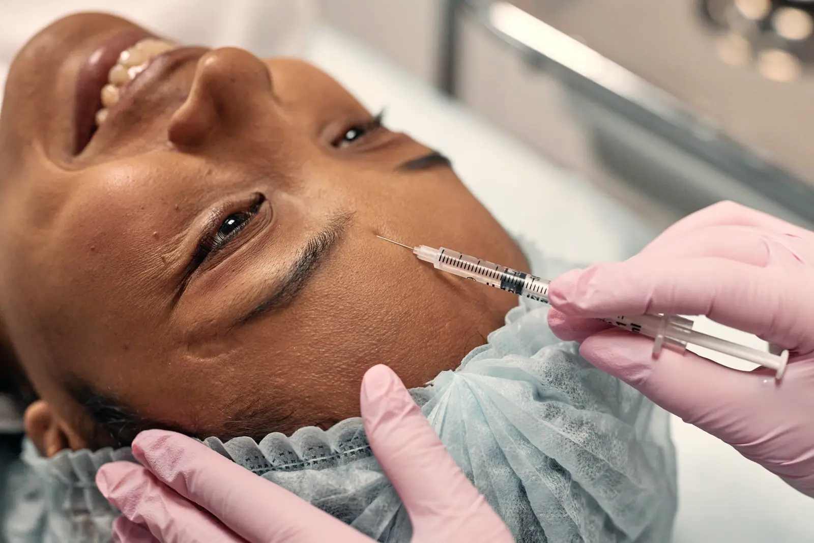 A client arriving at a beauty clinic reception