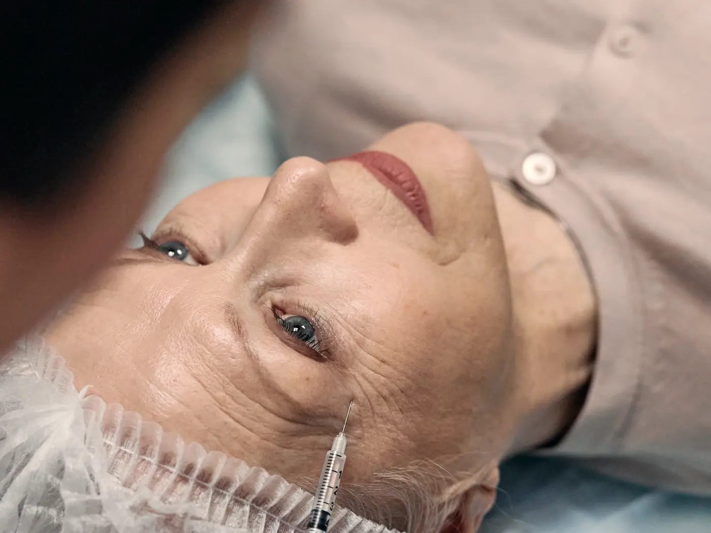 A close-up of an aesthetic facial treatment in progress